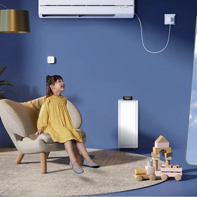 Child in a yellow dress sitting on a chair next to a Hub M3