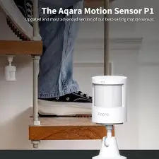 Aqara Motion Sensor P1 mounted on a staircase with a person walking down