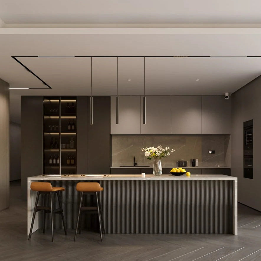Modern kitchen with island, bar stools, and decorative elements.