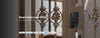 Smart gate lock U50Q on a decorative metal gate with brand logos at the bottom.
