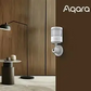 Motion & Light Sensor P2 mounted on a wall in modern living room setting.