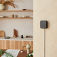 Hub M3 mounted on a wall with a blurred kitchen background