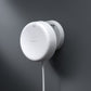A white Presence Sensor FP2 Angle Mount mounted on a dark gray wall