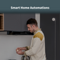 Man preparing food in a kitchen with the Smart Gas Detector mounted on the wall behind him