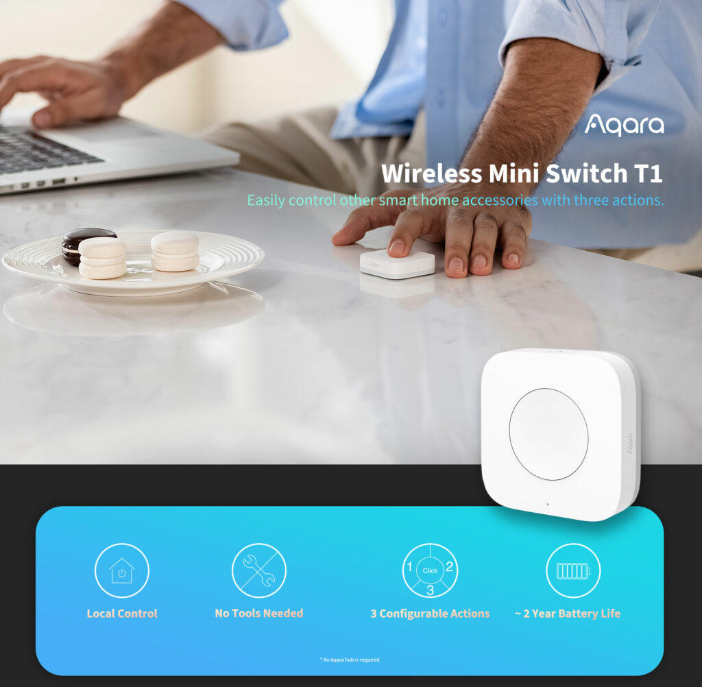 Aqara Wireless Mini Switch T1 being used on a desk with a person using a laptop.