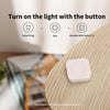 Wireless Mini Switch T1 on a wooden surface with text about controlling lights.
