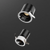 Two black spotlight fixtures on a dark gray background