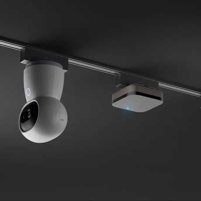 Track mounted on a kitchen ceiling with three spotlight modules positioned for counter illumination
